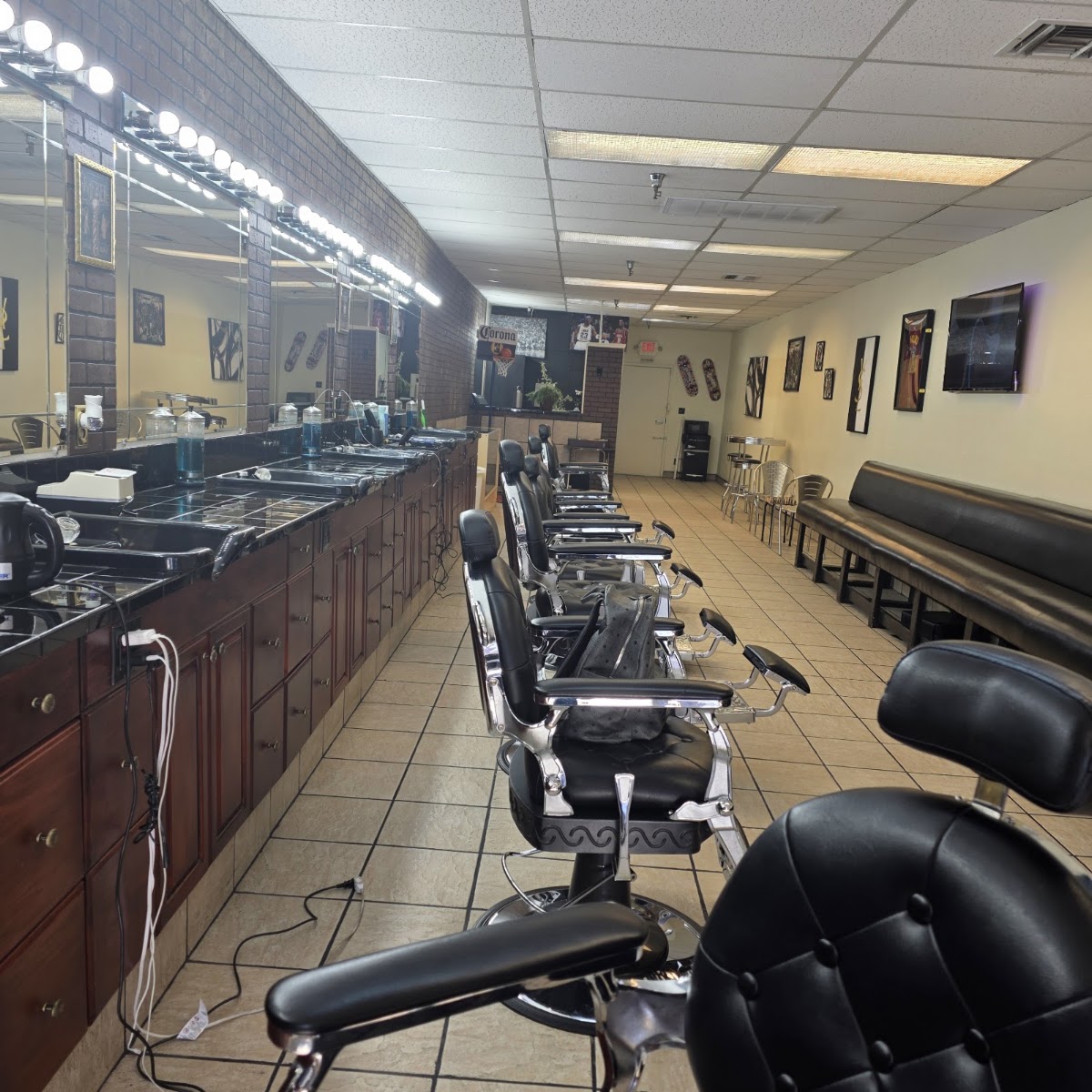 Row of black barber chairs inside 219 Barber Lounge