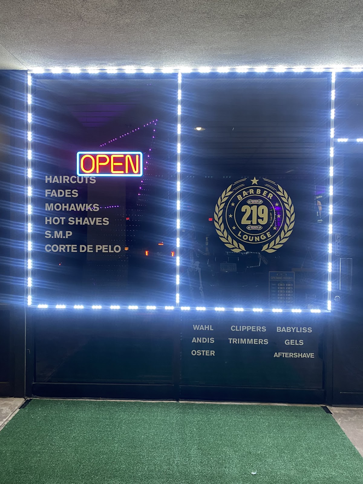 219 Barber Lounge illuminated storefront with LED lights
